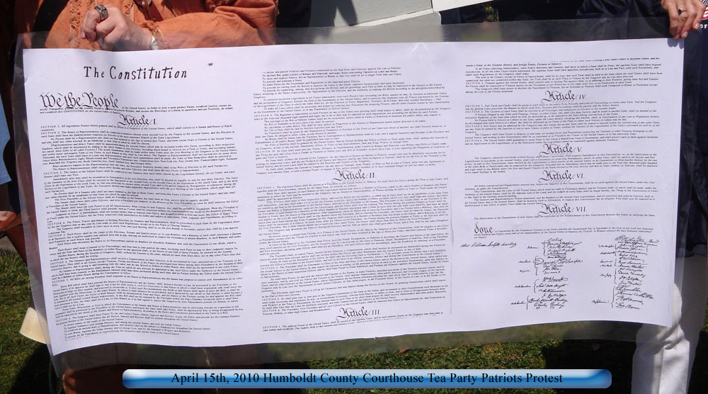 Tea Party Patriots holding up a copy of the US Constitution