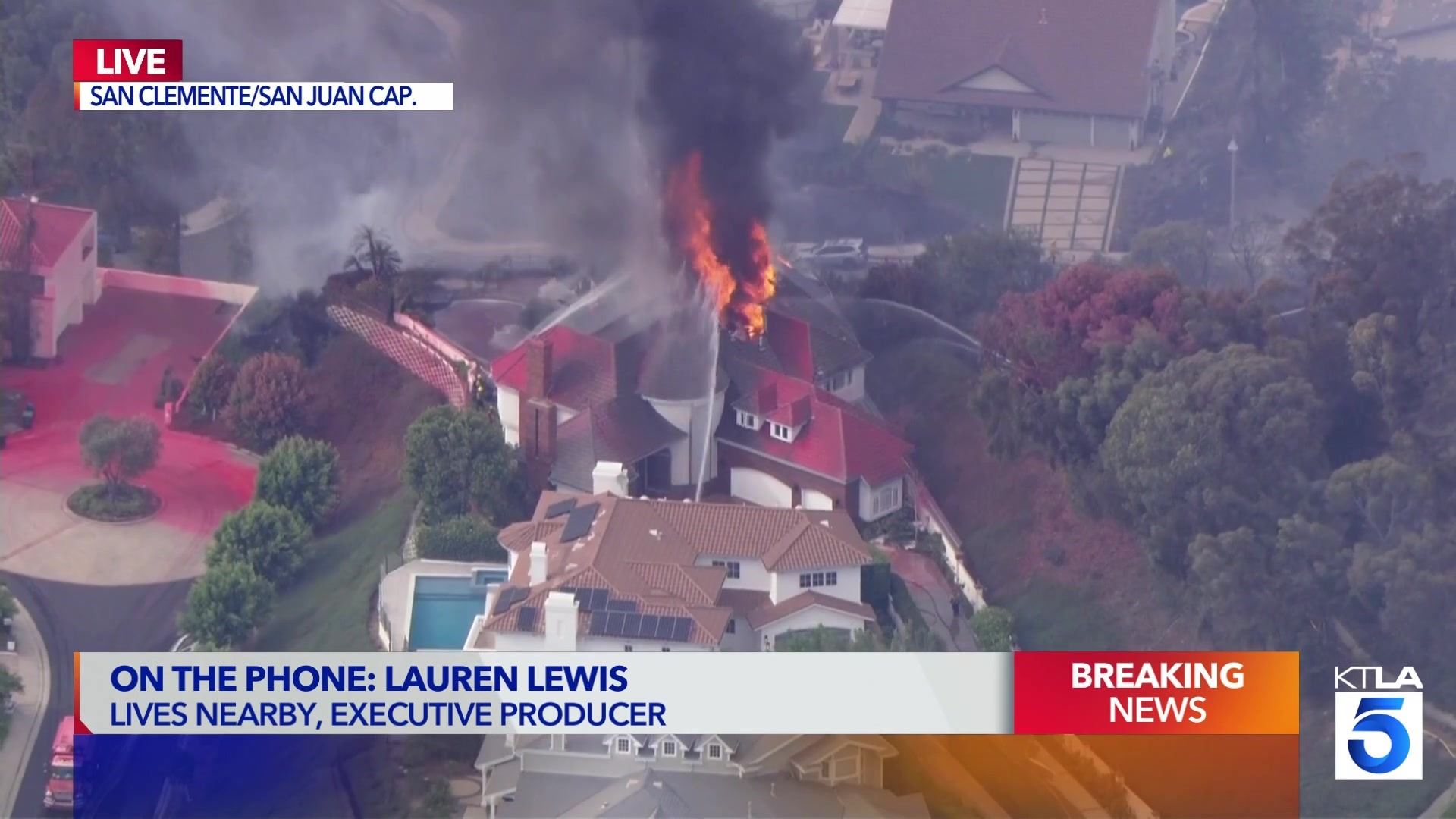 KTLA Sky5 still of a home with a red roof burning, San Clemente / San Juan Capistrano
