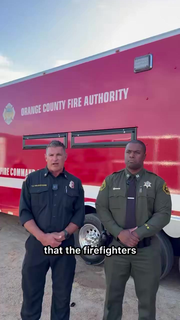 OCFA Fire Chief TJ McGovern and OC Sheriff Capt. Justin Chevalier in front of an OCFA command vehicle