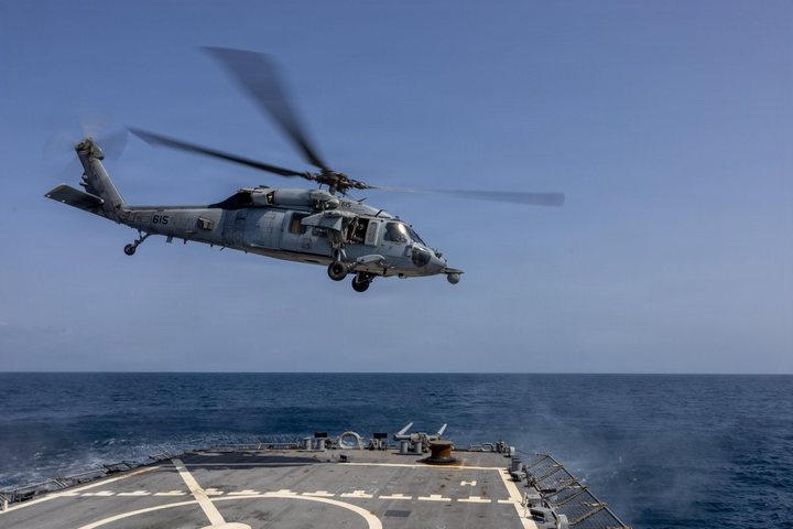 A Navy MH-60S Sea Hawk lifts off from USS John Paul Jones (DDG 53), supporting the blockade of Iran