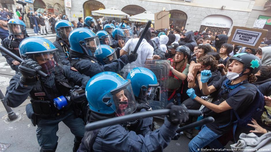 Riot police and protesters face off in Milan