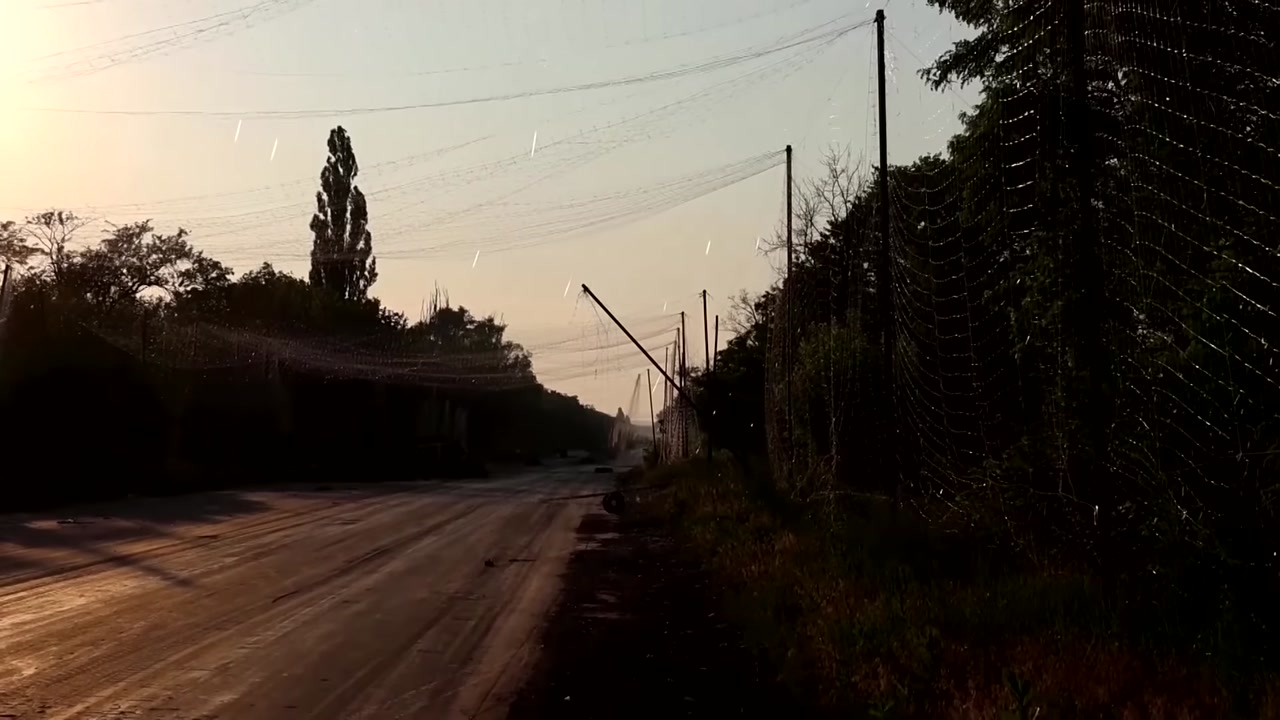 Fiber-optic strands over a town (frame)